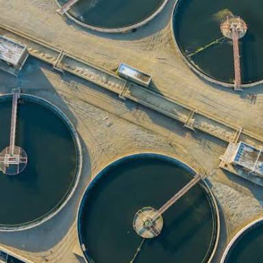 Could adopting industrial waste as a resource for wastewater purification establish a sustainable economic model for power-intensive industries?
